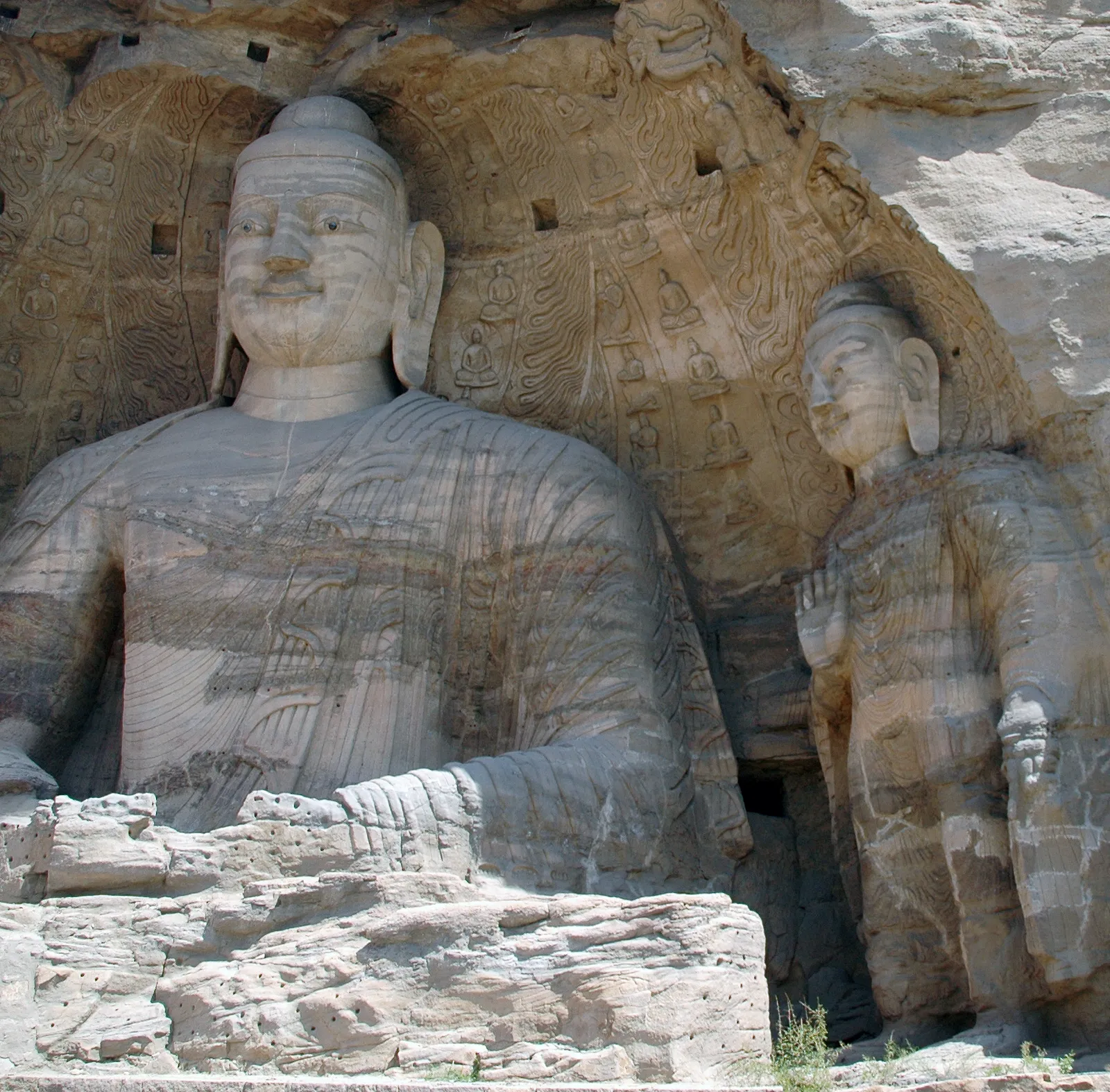The giant seated Buddha carved from the cliff face in Cave 20 of the Yungang Grottoes near Datong