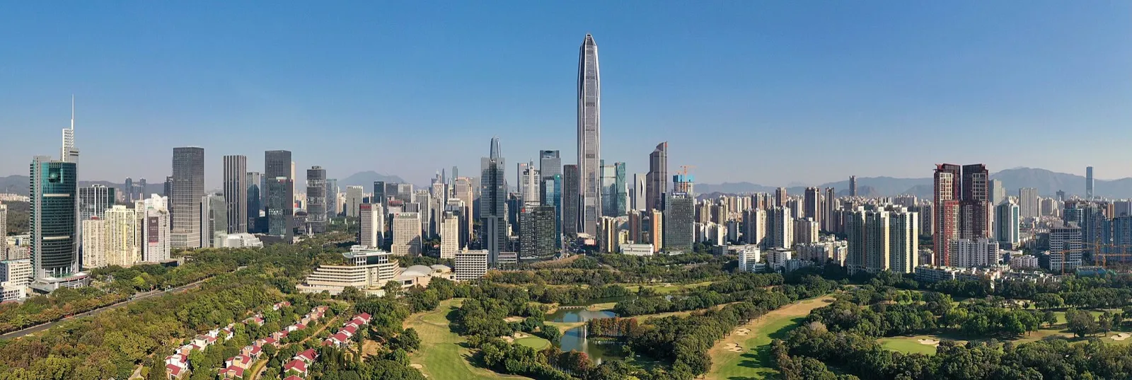 The Futian skyline of Shenzhen at dusk with the Ping An Finance Center tower