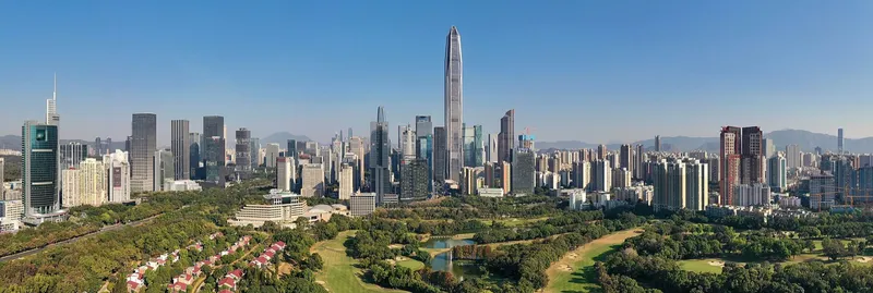 The Futian skyline of Shenzhen at dusk with the Ping An Finance Center tower