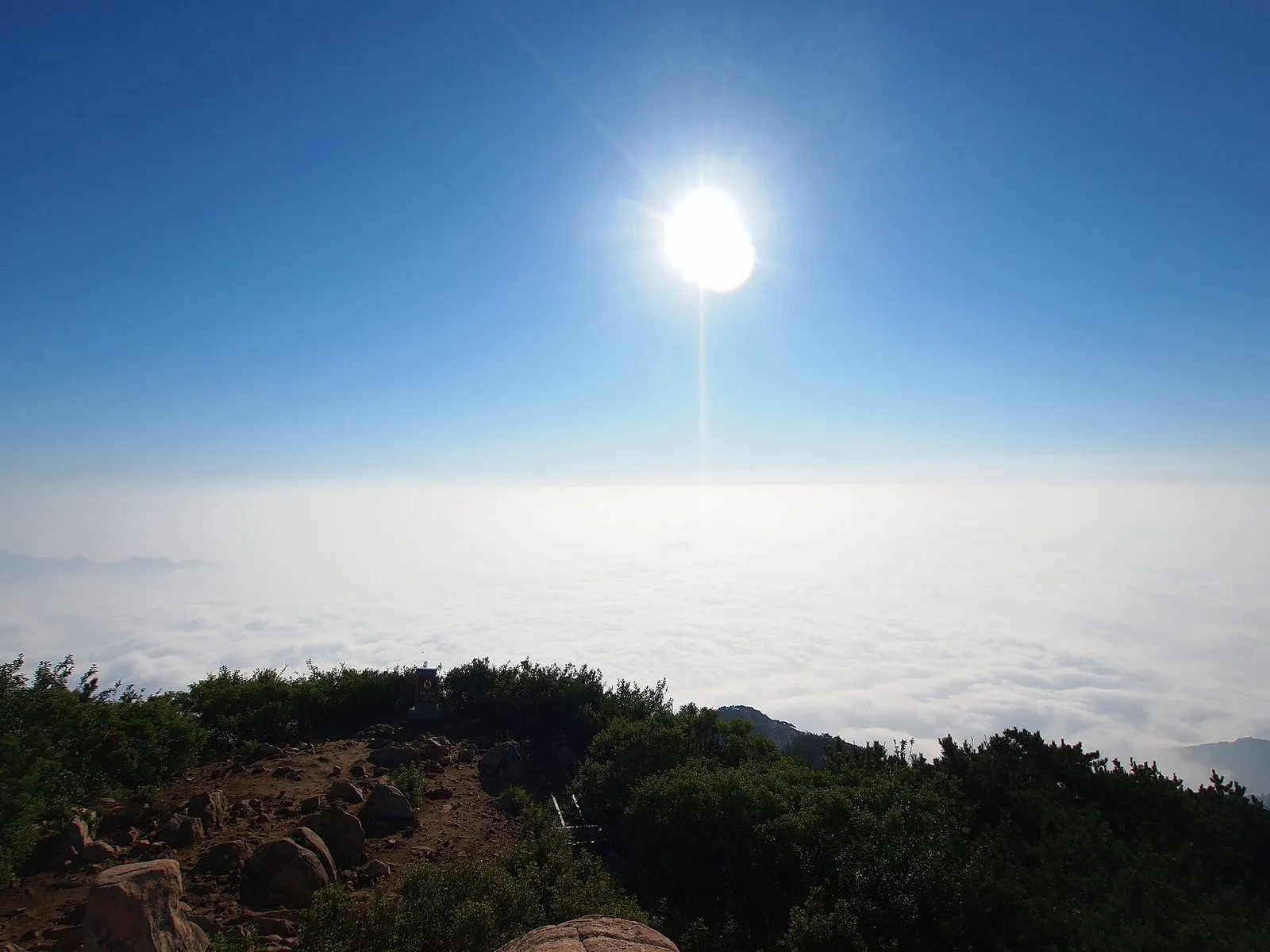 Sea of clouds breaking over the granite ridgelines of Mount Tai above Tai'an